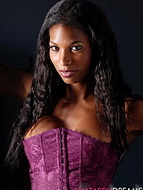 Exciting in purple. Adorable ebony shemale Natassia posing excited in purple